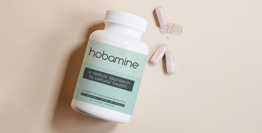 dietary supplement bottle with Hobamine (2-HOBA) and a couple of pill capsules